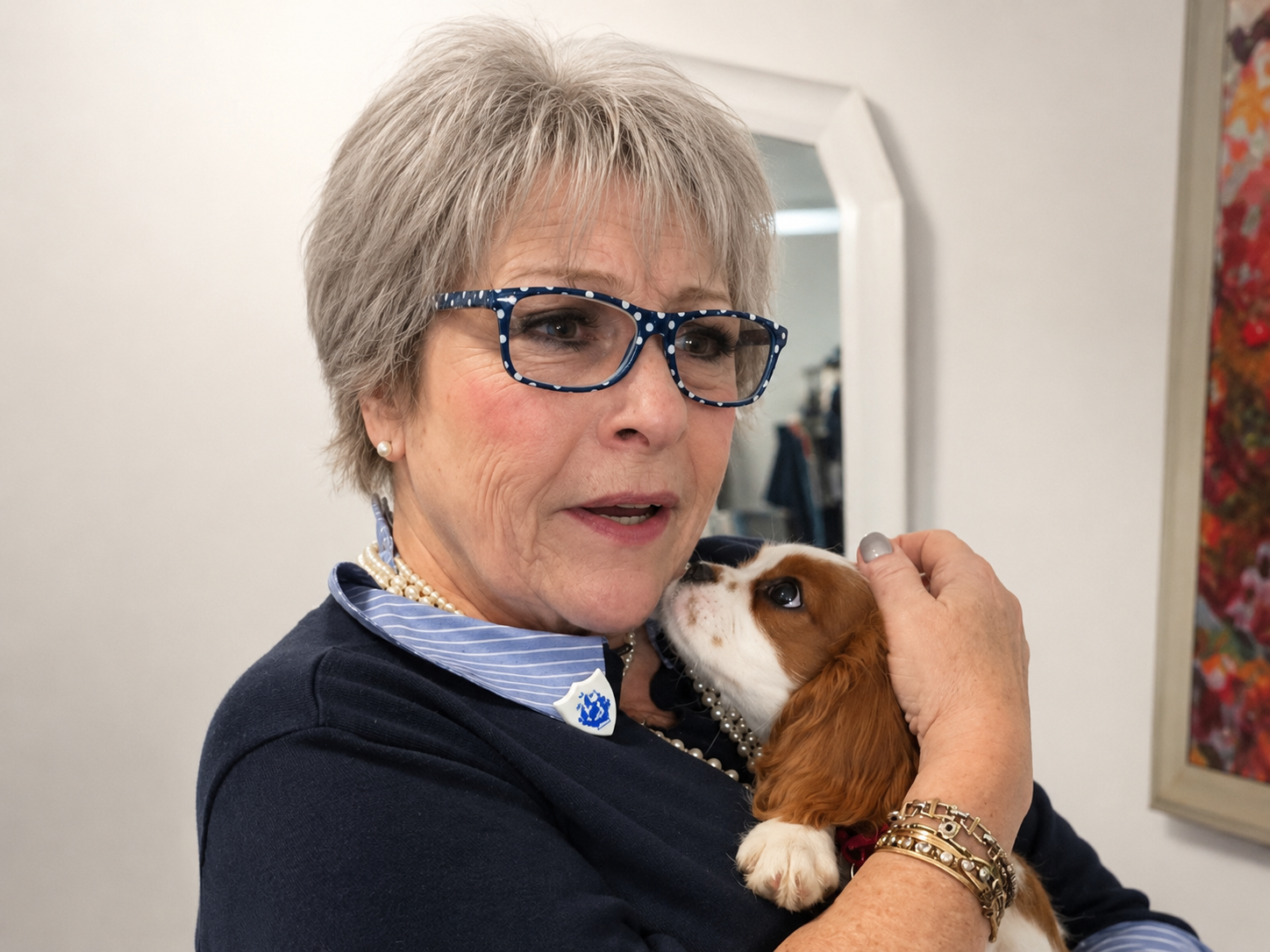 The carer with a small dog at home